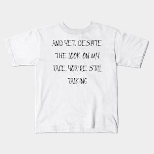 and yet despite the look on my face Kids T-Shirt